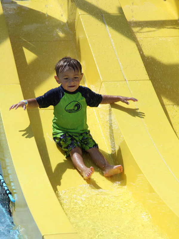 Splash pool from 0″ to 12″ of water with all interactive water play. Short slides that sit next to each. Half the fun is climbing and playing your way to the top before sliding down.